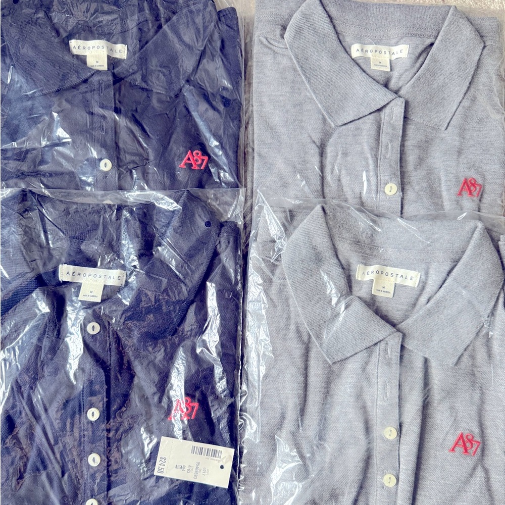 Four (4) women’s size medium Aeropostale polos.  2 gray, 2 navy with pink logo.